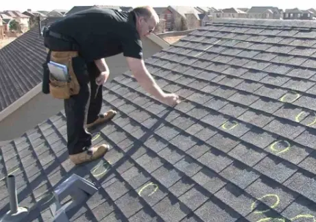 Empire Roofing MN contractor performing a free roof inspection on a Duluth MN home