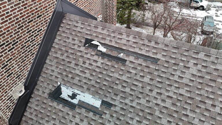 A northern Minnesota roof showing visible storm damage