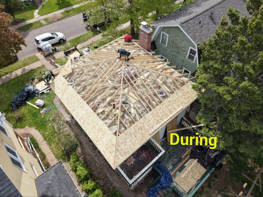Roof framing and decking during a room addition roof installation on a northern Minnesota home by Empire Roofing.