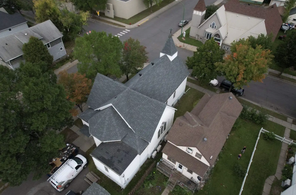 Aerial view of properties during a professional roof inspection in Chisholm, MN by Empire Roofing.