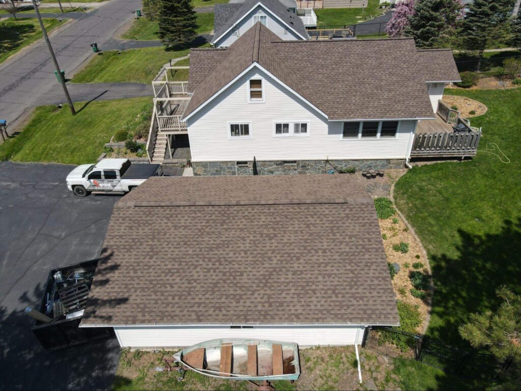 Empire Roofing truck in a Virginia, MN property during a roof inspection.