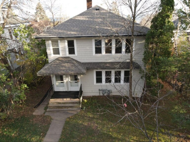 New vinyl shake siding on a two-story Duluth home after replacement by Empire Roofing